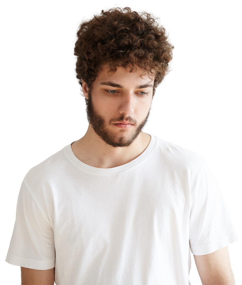 man with curly hair staring down
