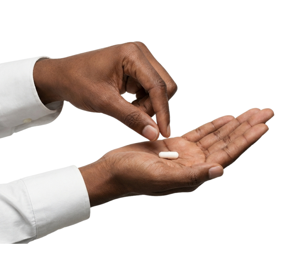 hands holding oral minoxidil pills
